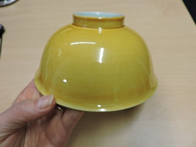 Lot 147 - A Chinese yellow glazed bowl