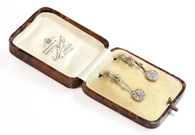 Lot 189 - A pair of diamond set daisy cluster drop earrings, c.1930