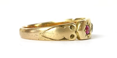 Lot 1032 - A gold diamond and ruby three stone ring