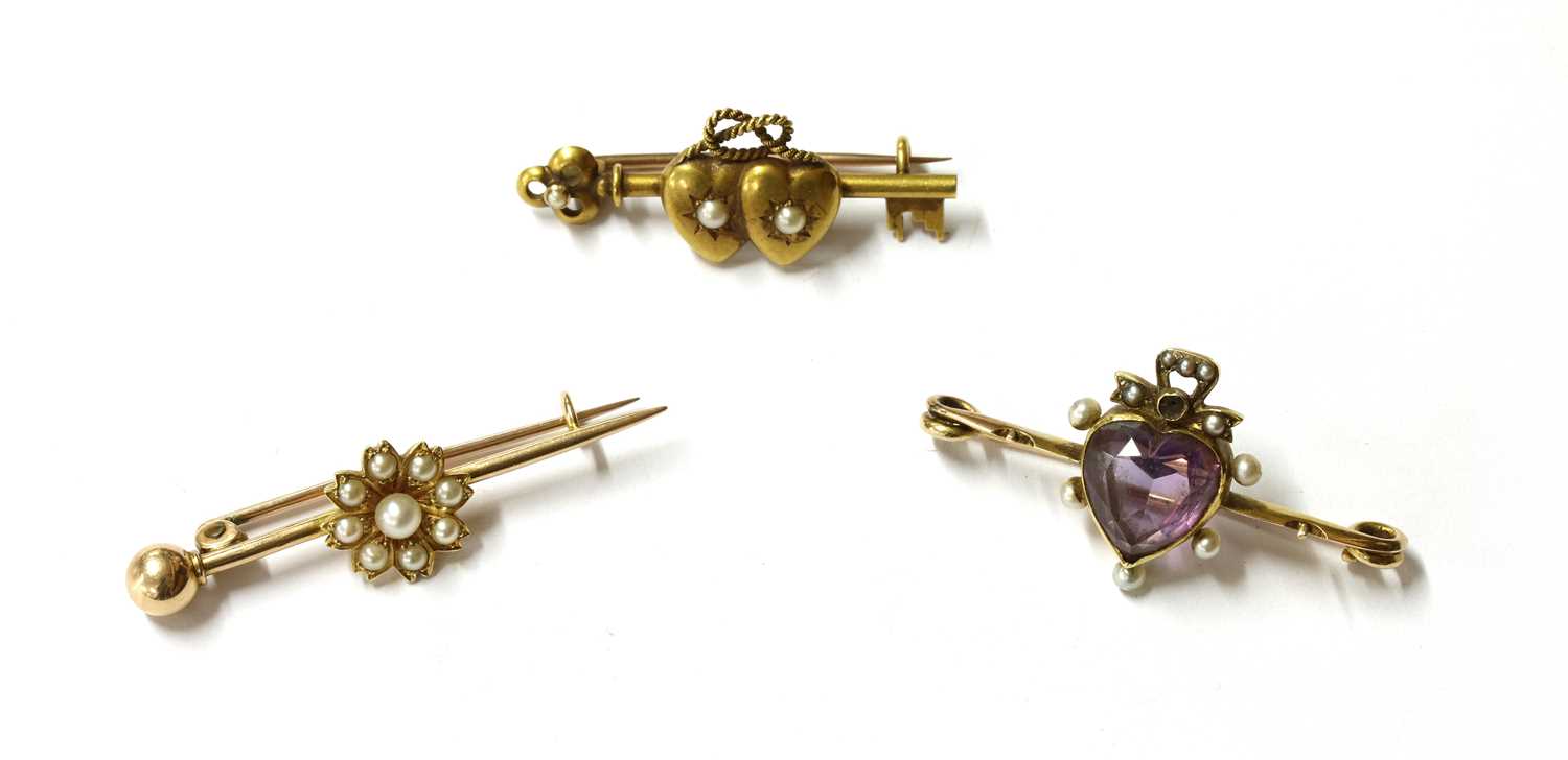 Lot 43 - A Victorian gold split pearl set bar brooch