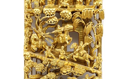 Lot 186 - A Balinese gilded wall plaque with dancers dancing and warriors jousting