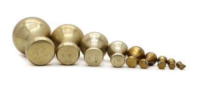 Lot 152 - A composed set of ten brass bell weights