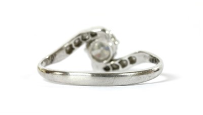 Lot 1122 - A platinum diamond crossover ring
