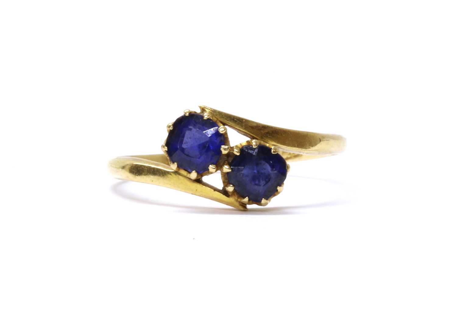 Lot 4 - A gold two stone doublet crossover ring