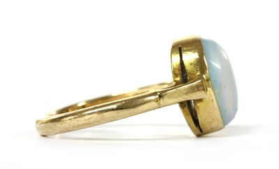 Lot 1058 - A gold single stone opal ring