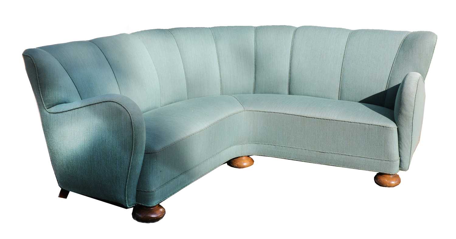 Lot 351 - A turquoise upholstered corner settee