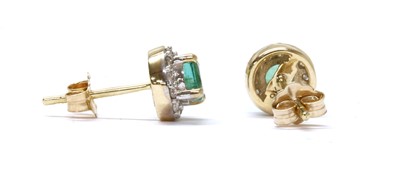 Lot 160 - A pair of gold emerald and diamond cluster stud earrings
