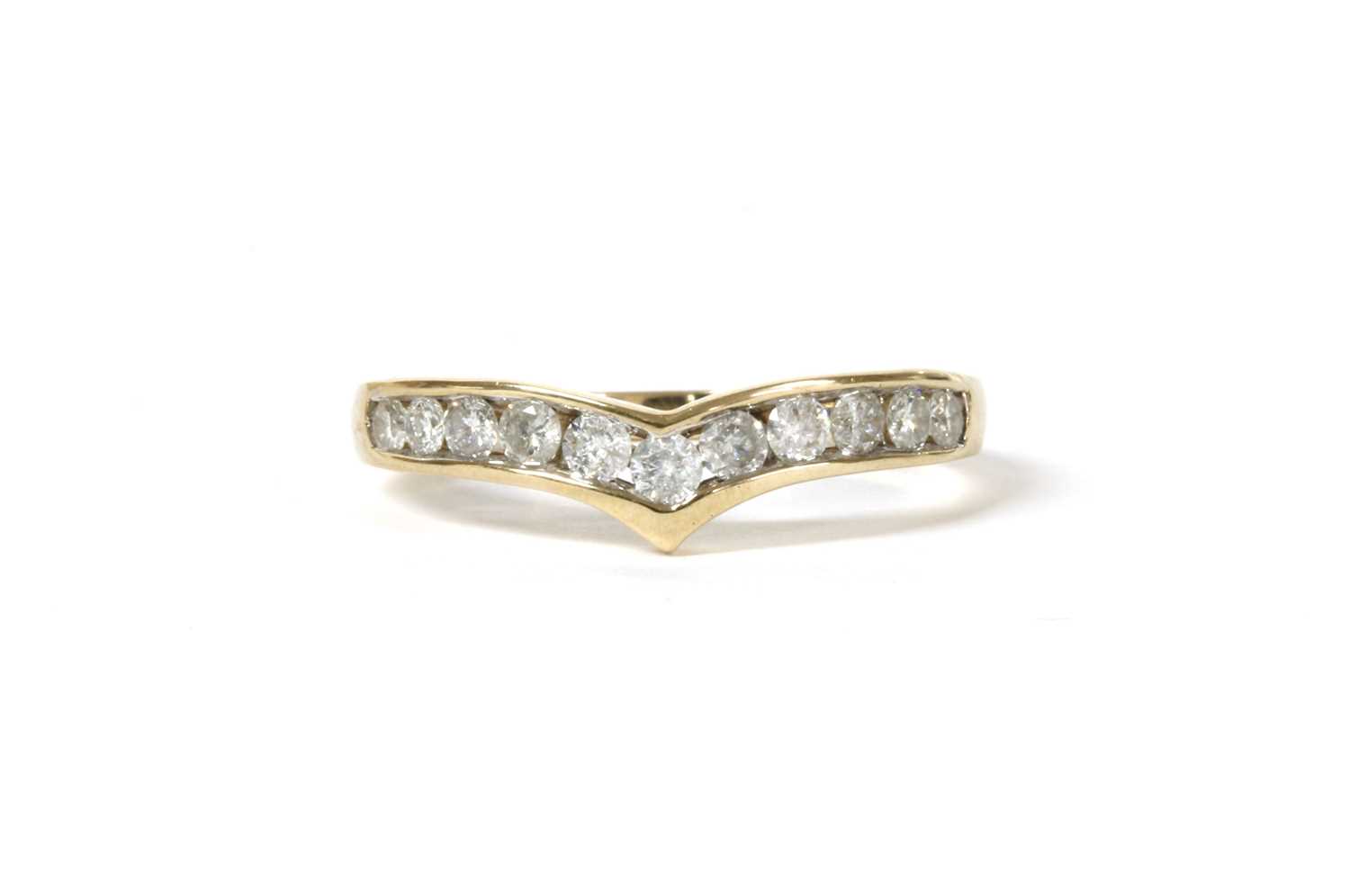 Lot 140 - A gold diamond wishbone-shaped half eternity ring