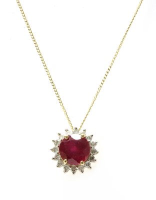 Lot 122 - A gold fracture filled ruby and diamond cluster pendant