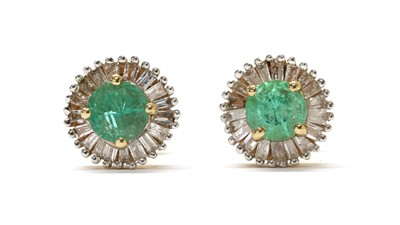 Lot 275 - A pair of gold emerald and diamond cluster stud earrings