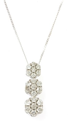Lot 169 - A white gold diamond cluster pendant