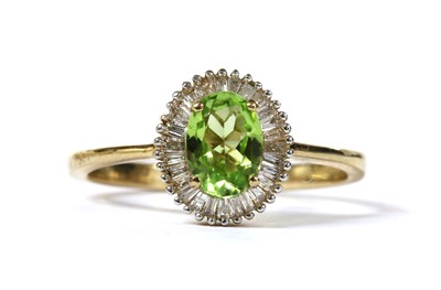 Lot 264 - A gold peridot and diamond cluster ring