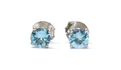Lot 182 - A pair of white gold blue zircon stud earrings