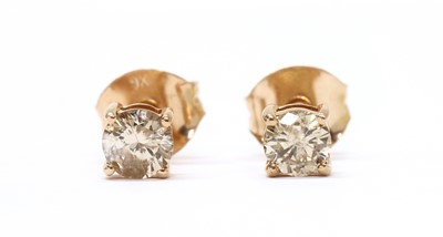 Lot 96 - A pair of rose gold single stone diamond stud earrings