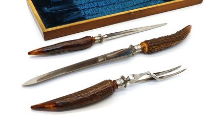 Lot 27 - A horn and silver mounted three piece carving set