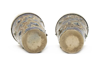 Lot 134 - A pair of Doulton Lambeth stoneware and silver mounted beakers