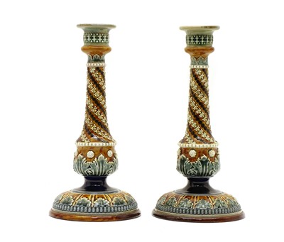 Lot 136 - A pair of Doulton Lambeth stoneware candlesticks
