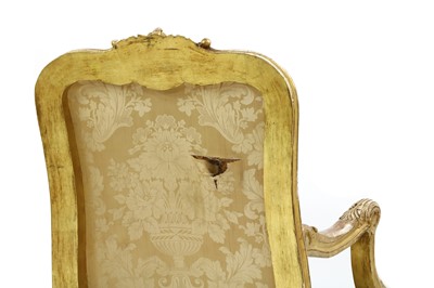 Lot 327 - A pair of French Regence-style giltwood fauteuils