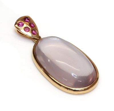 Lot 433 - A gold rose quartz and ruby pendant
