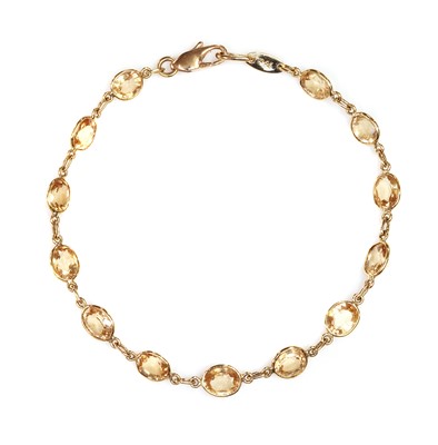 Lot 374 - A gold hessonite garnet bracelet