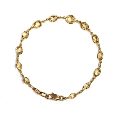 Lot 259 - A gold hessonite garnet bracelet