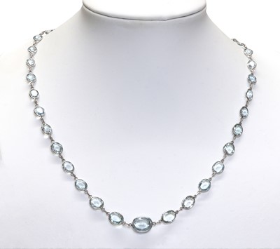 Lot 280 - A white gold aquamarine and blue topaz rivière necklace