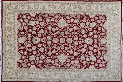 Lot 340 - A large wool carpet of Persian Ziegler design