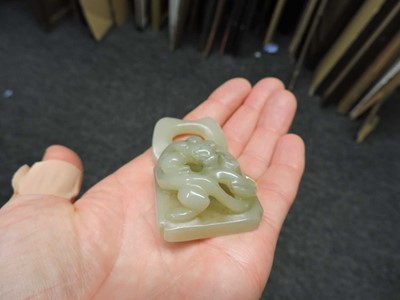 Lot 263 - A Chinese jade two-part belt buckle