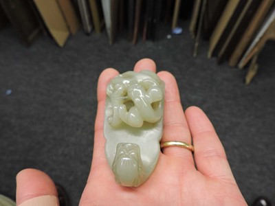 Lot 263 - A Chinese jade two-part belt buckle