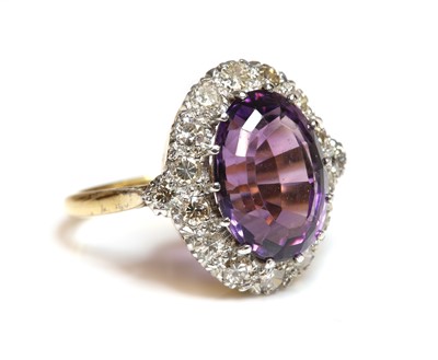 Lot 340 - An amethyst and diamond oval cluster ring