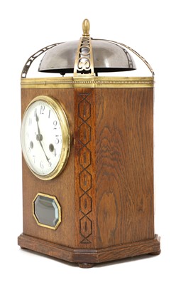 Lot 20 - An oak and brass-mounted mantel clock