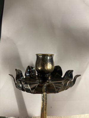 Lot 65 - An Arts and Crafts silver-plated candlestick