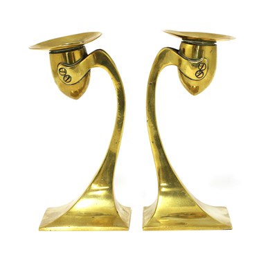 Lot 138 - A pair of Arts and Crafts brass candlesticks