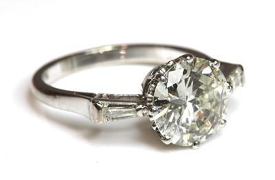 Lot 258 - A white gold three stone diamond ring