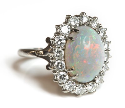 Lot 449 - A white gold opal and diamond cluster ring