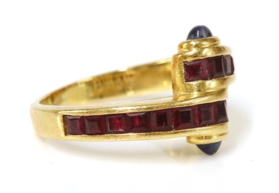 Lot 473 - A gold ruby and sapphire crossover ring