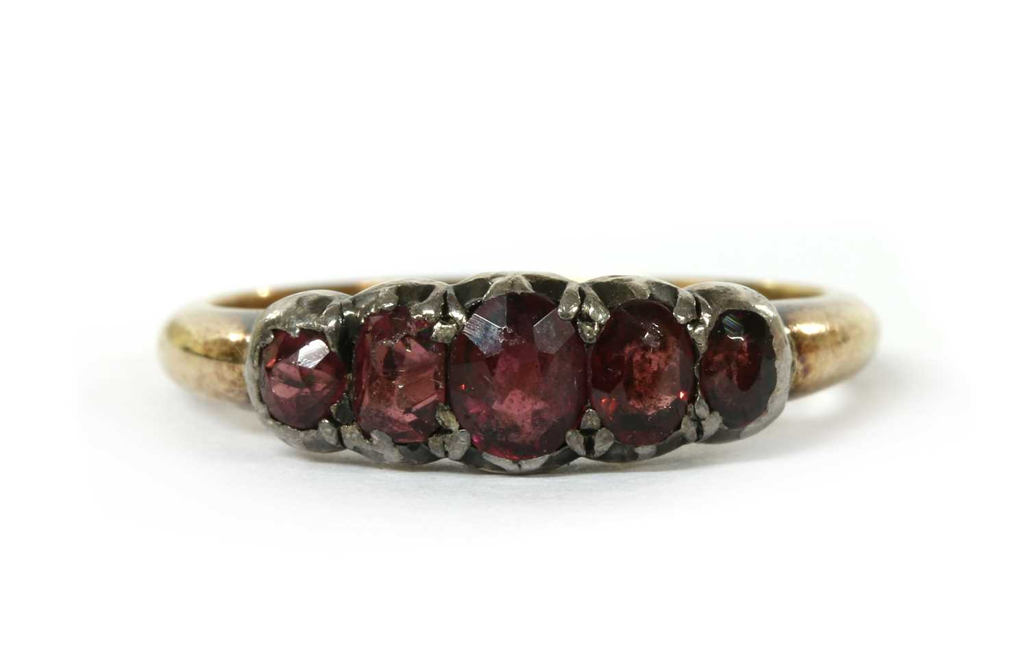 Lot 1025 - A gold and silver garnet ring