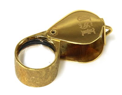 Lot 283 - An 18ct gold cased loupe