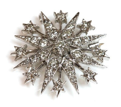 Lot 358 - A 9ct white gold Victorian style diamond set star brooch/pendant