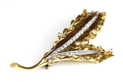 Lot 274 - A diamond set fern brooch