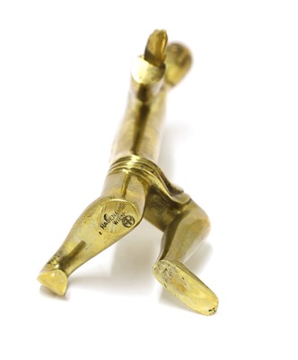Lot 319 - A Hagenauer polished brass figure of a kneeling man