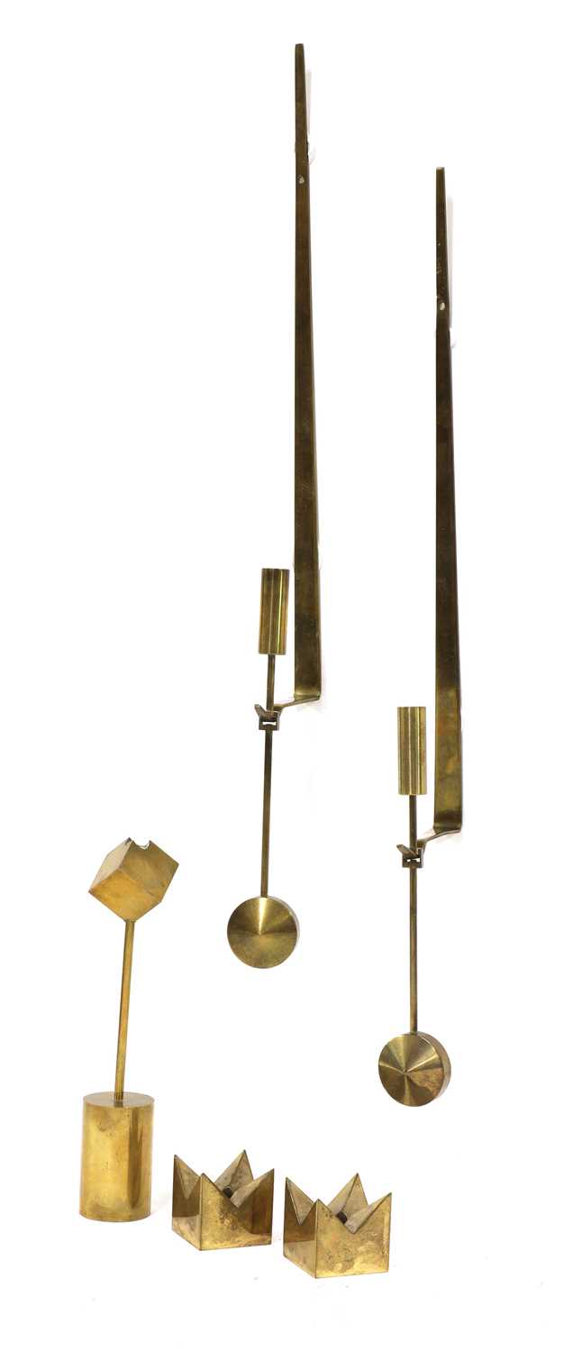 Lot 502 - Five brass candlesticks