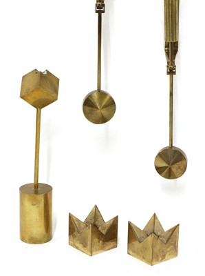 Lot 502 - Five brass candlesticks