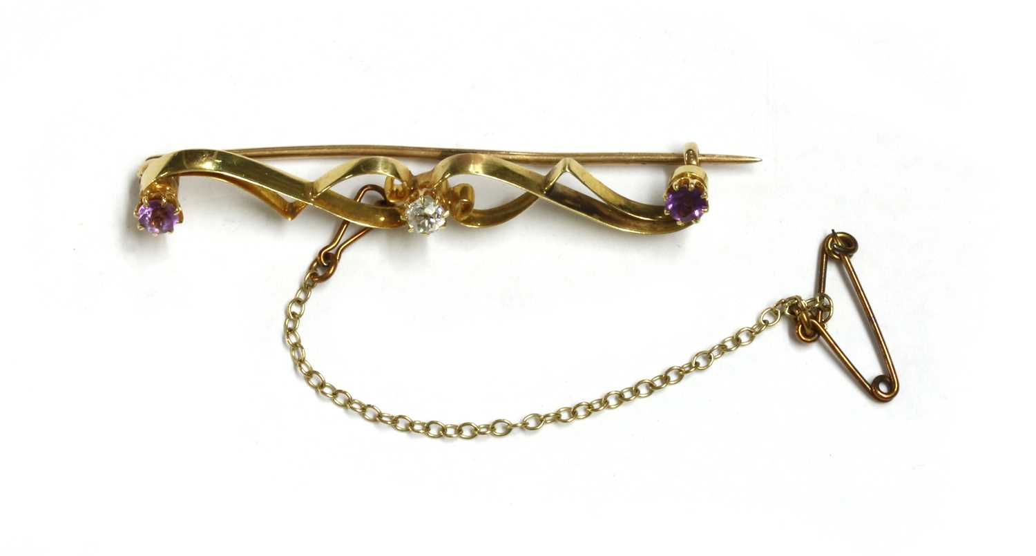 Lot 24 - A gold diamond and amethyst brooch
