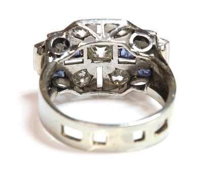 Lot 179 - An Art Deco diamond and sapphire stepped plaque ring, c.1935