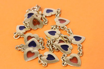 Lot 328 - A gold enamel heart link necklace