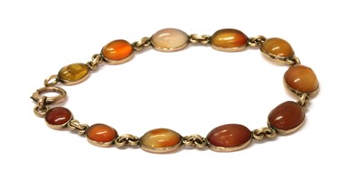 Lot 1171 - A gold agate bracelet