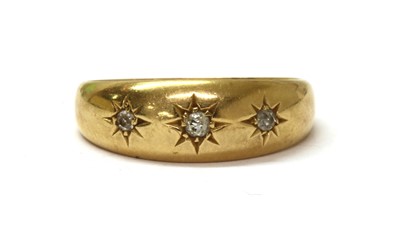 Lot 23 - An 18ct gold three stone diamond ring