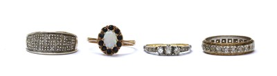 Lot 392 - A gold three stone diamond ring