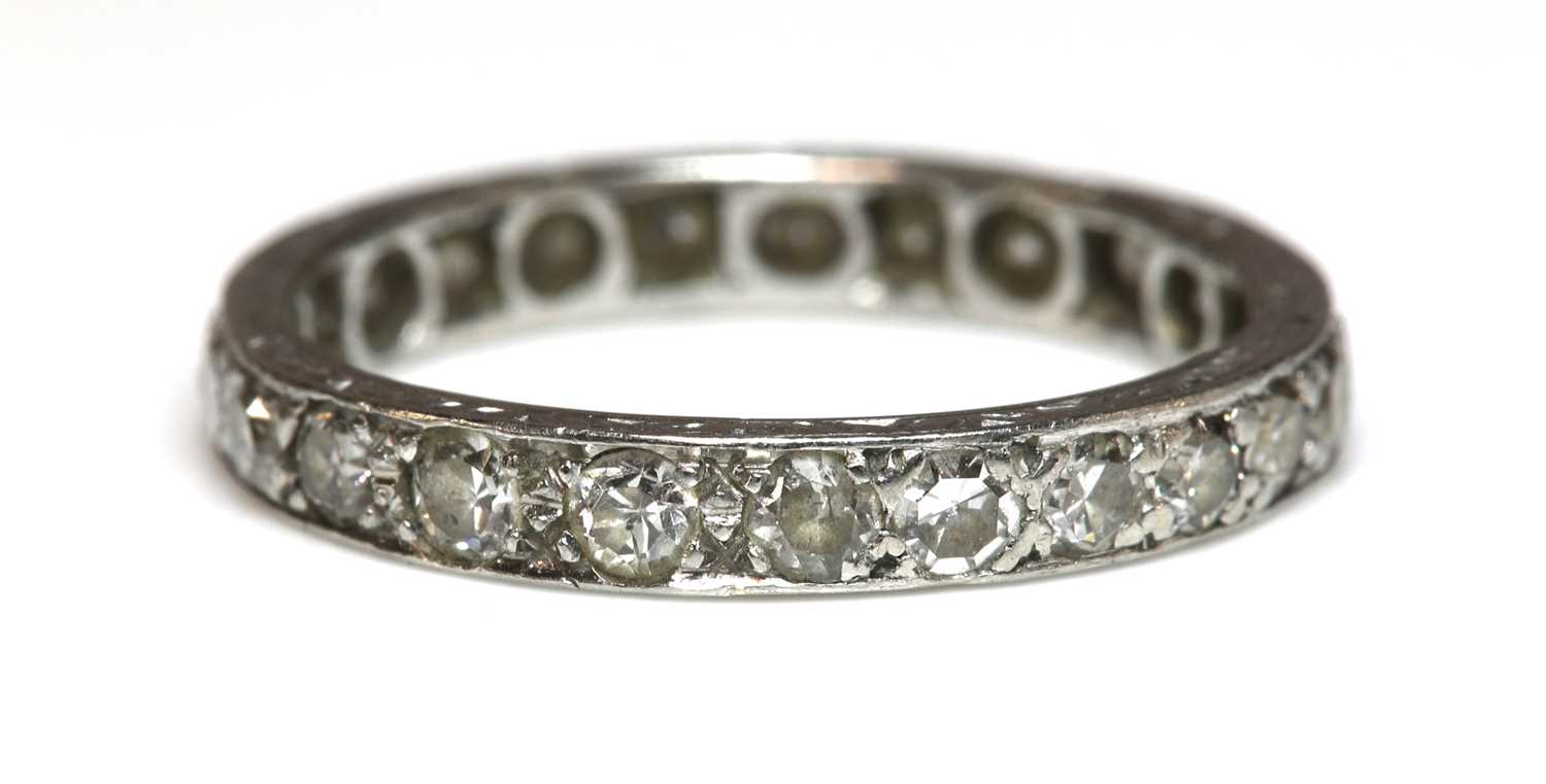 Lot 183 - A diamond set full eternity ring